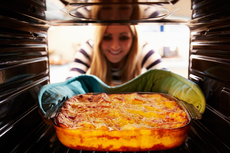 Thick, bubbling lasagna layered with sausage, spinach, and melted cheese, including gooey pockets of MouCo ColoRouge peeking through the top. Rustic, rich, and ready to eat.