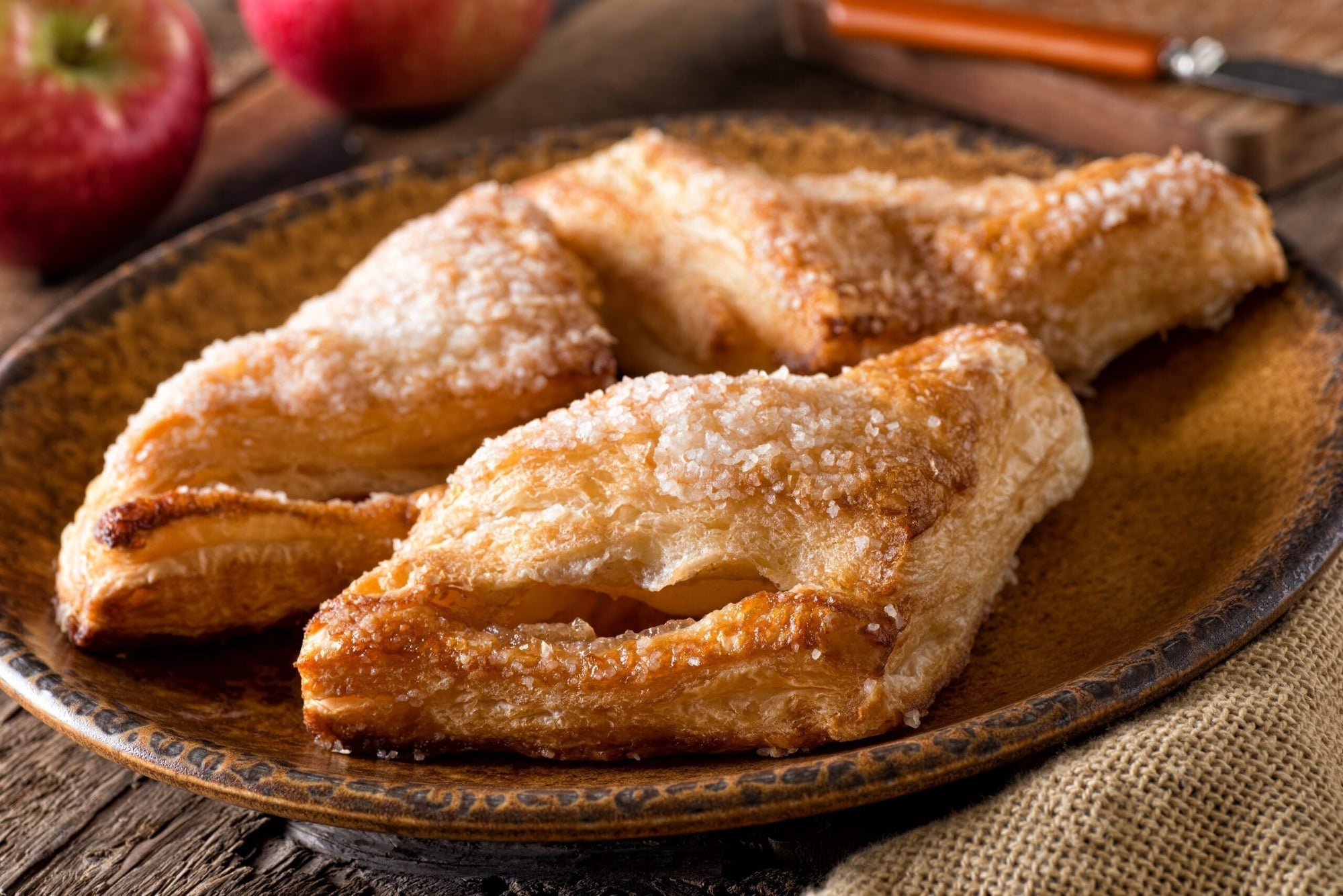 Golden puff pastry turnovers with melted MouCo Camembert and chunks of fresh nectarine peeking out the edges. Flaky, glossy, and summer-sweet.