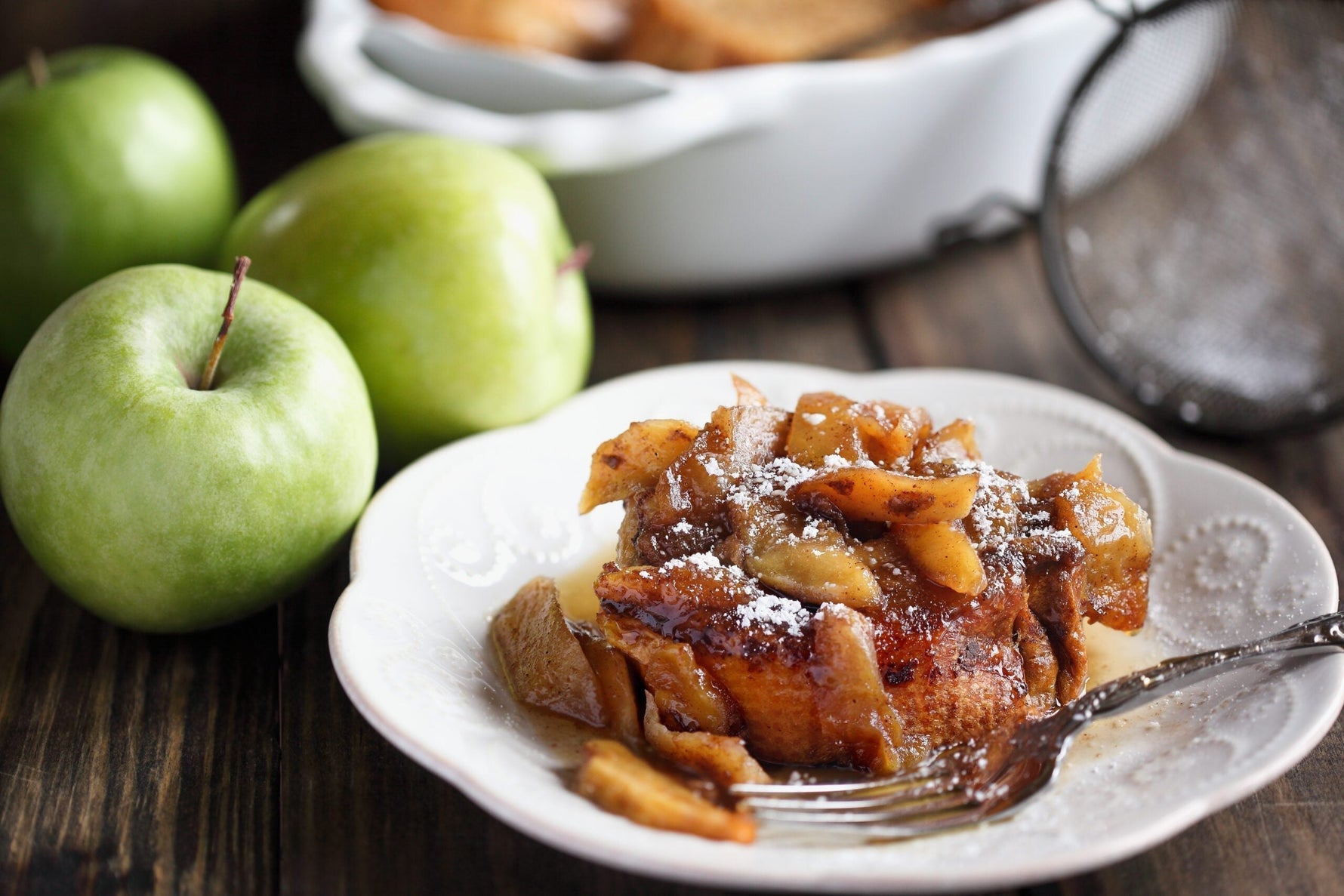 Golden French toast stuffed with MouCo Truffle Camembert and apple slices, topped with fresh orange zest—a rich, savory-sweet brunch indulgence.