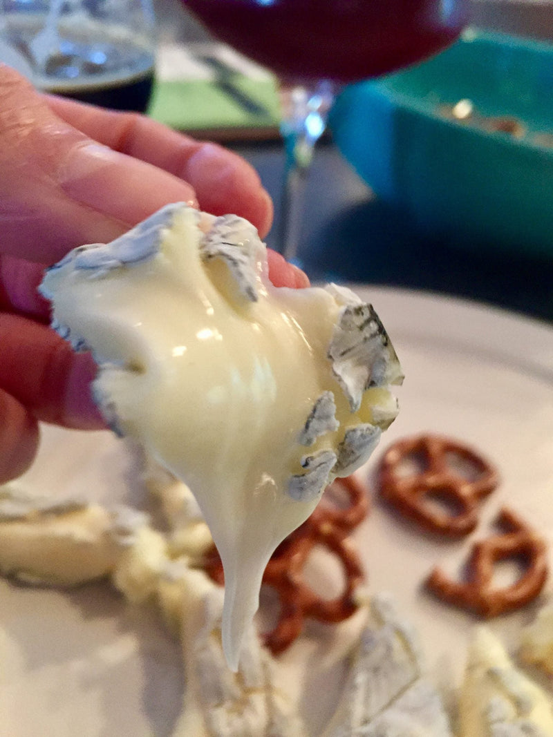 Fully aged MouCo Ashley with a dark, wrinkled rind and gooey, creamy center—bold, rich, and made for pairing with your favorite wine, beer, or anything that needs a little cheese magic.