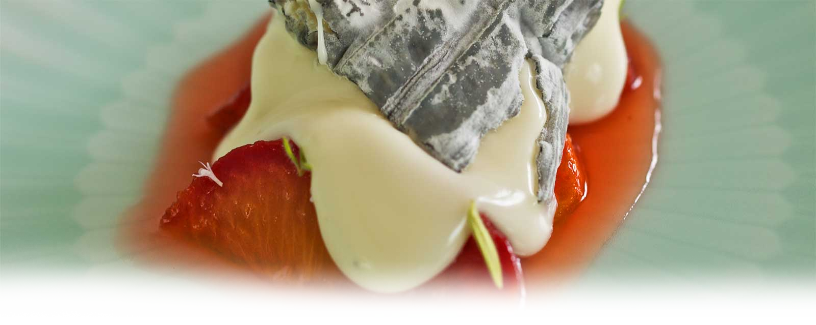 Sliced peaches in syrup topped with MouCo Ashley cheese and rosemary—drizzled with honey and glowing with soft, summery richness.