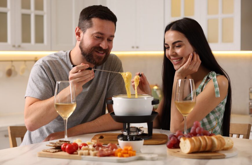 Couple enjoying MouCo ColoRouge cheese fondue.