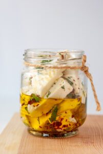 Jar of MouCo Cheese Courage Marinated with Olive Oil and Herbs